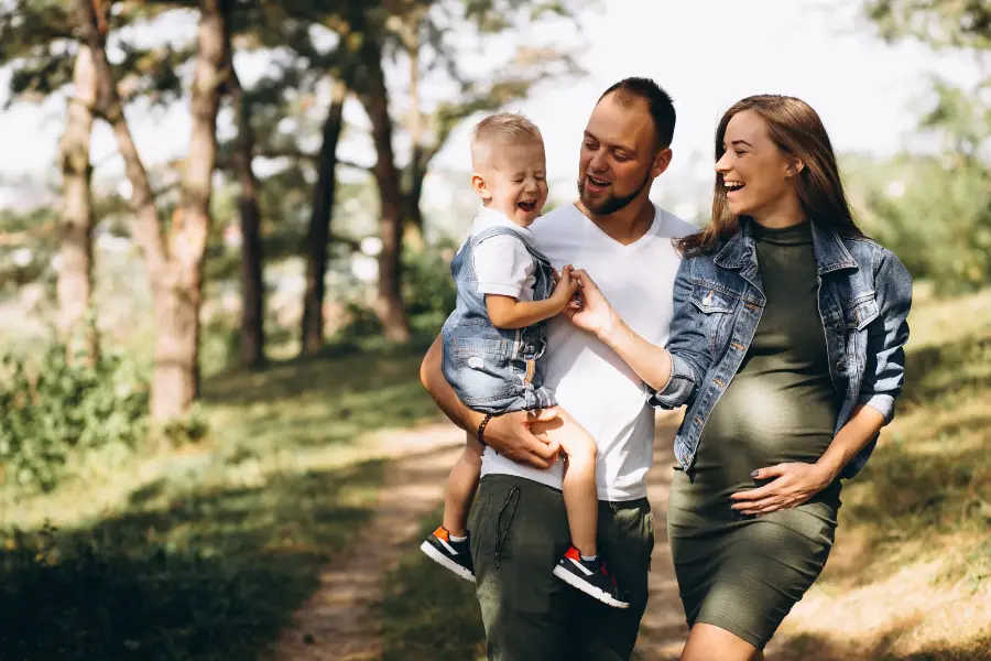 Husband with pregnant wife and their son